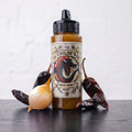 Aderezo de miel infusionada con ajo chilote cabra Chiloé Hot Honey